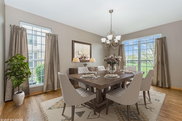 685 Veronica Ct, New Lenox, IL 60451 - dining room with a chandelier, healthy amount of natural light, and light wood-type flooring