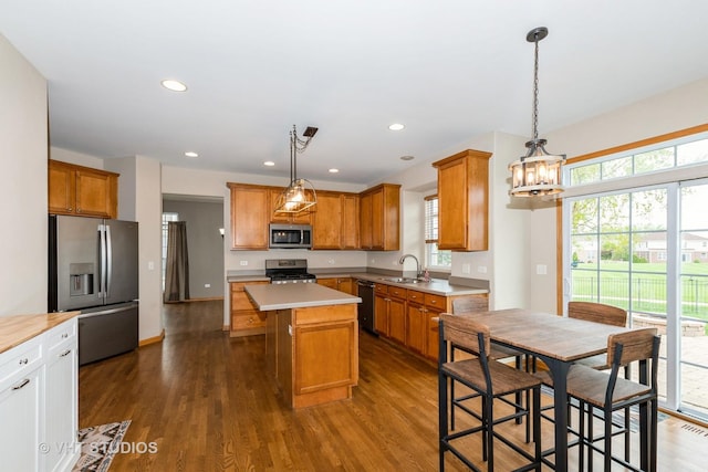 685 Veronica Ct, New Lenox, IL 60451 - kitchen featuring stainless steel appliances, a sink, a center island, a chandelier, and dark wood-type flooring
