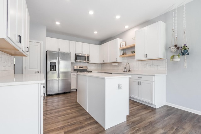 kitchen with stainless steel appliances, backsplash, open shelves, and recessed lighting