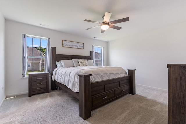 bedroom with carpet flooring, a ceiling fan, and baseboards