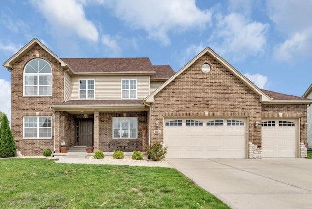 view of front of property featuring an attached garage, concrete driveway, brick siding, and a front yard