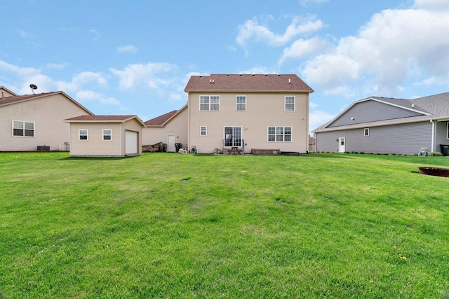 back of house with a lawn and central AC