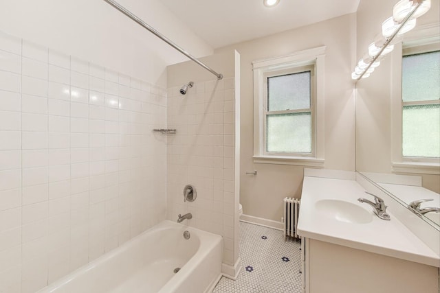 1431 W Rascher Ave Unit 1W, Chicago, IL 60640 - full bath with vanity, tile patterned flooring, toilet, radiator heating unit, and washtub / shower combination
