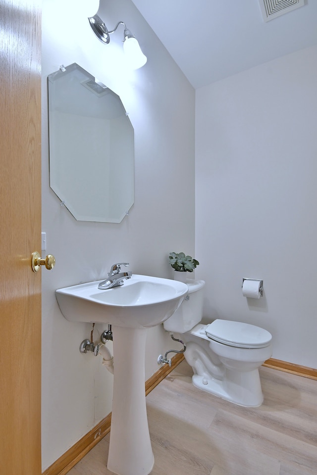 3244 Foxridge Ct, Woodridge, IL 60517 - bathroom featuring baseboards, toilet, wood finished floors, and a sink