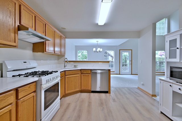 3244 Foxridge Ct, Woodridge, IL 60517 - kitchen with dishwasher, gas range gas stove, under cabinet range hood, light wood-style floors, and a sink