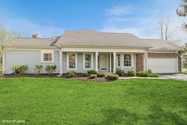 view of front of house featuring a shingled roof, a garage, a front yard, a chimney, and concrete driveway