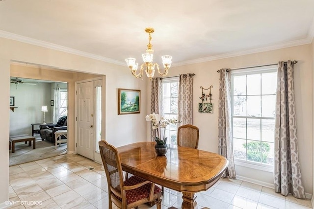 dining area featuring crown molding, an inviting chandelier, plenty of natural light, and light tile patterned floors