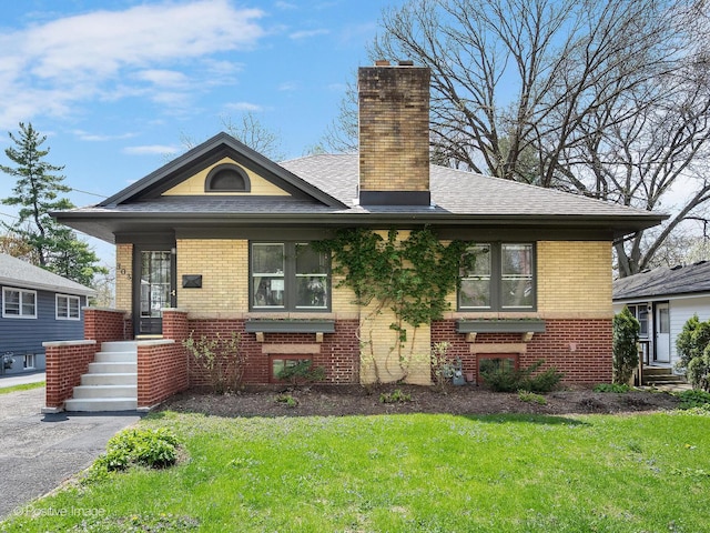 303 Anthony St, Glen Ellyn, IL 60137 - bungalow-style house featuring brick siding, a chimney, and a front lawn