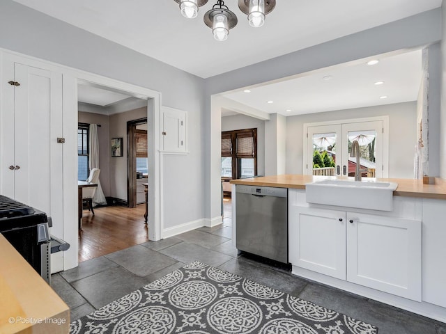 303 Anthony St, Glen Ellyn, IL 60137 - kitchen featuring stainless steel appliances, a sink, white cabinets, a chandelier, and wood counters