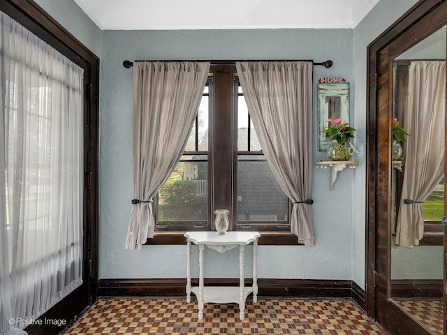 303 Anthony St, Glen Ellyn, IL 60137 - living area with tile patterned floors, plenty of natural light, and baseboards