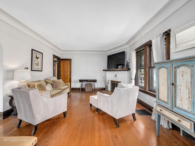 303 Anthony St, Glen Ellyn, IL 60137 - living room featuring baseboards, wood finished floors, and a fireplace