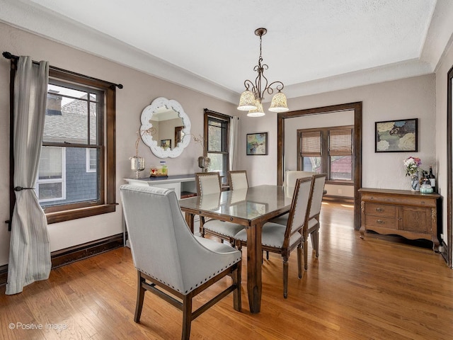 303 Anthony St, Glen Ellyn, IL 60137 - dining area featuring light wood-type flooring, a chandelier, and baseboards