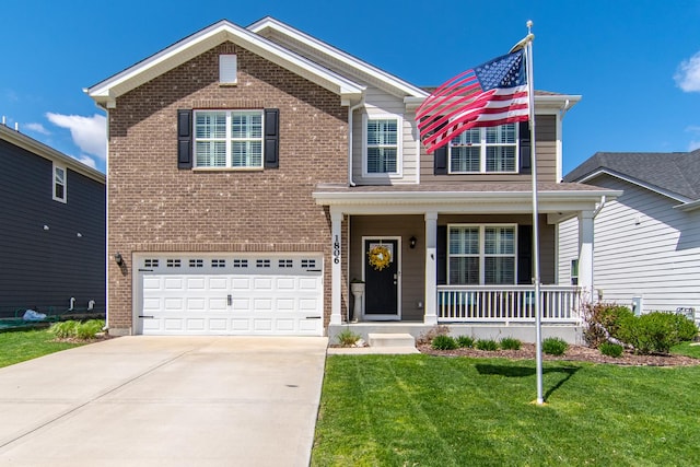 view of front of house with a garage, a front yard, brick siding, a porch, and driveway