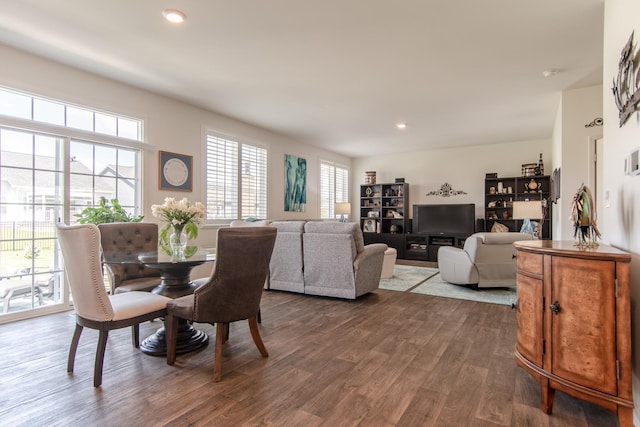 dining area with recessed lighting and dark wood-type flooring