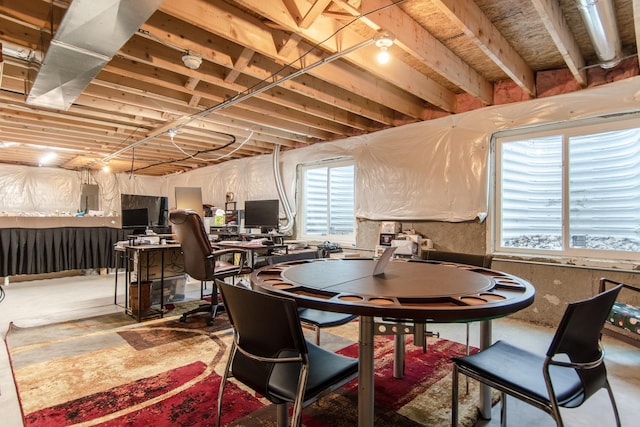 dining room featuring concrete flooring and electric panel