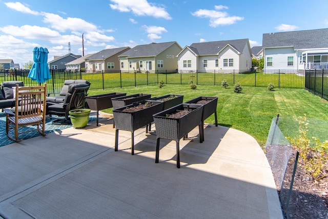 view of patio / terrace featuring fence and a residential view