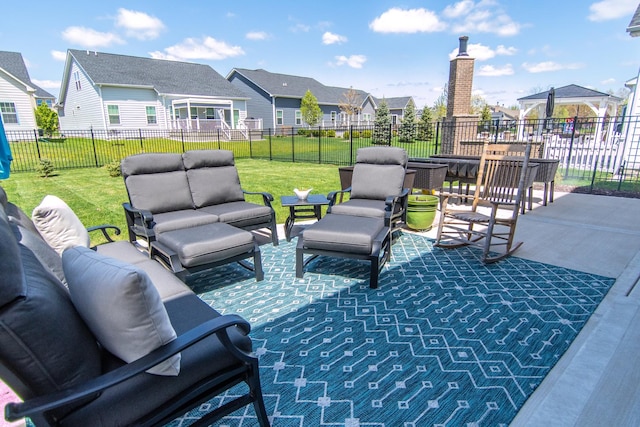 view of patio with an outdoor living space, a residential view, and a fenced backyard