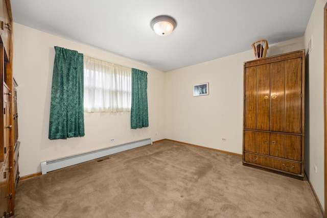 unfurnished bedroom with baseboards, a baseboard radiator, and carpet flooring