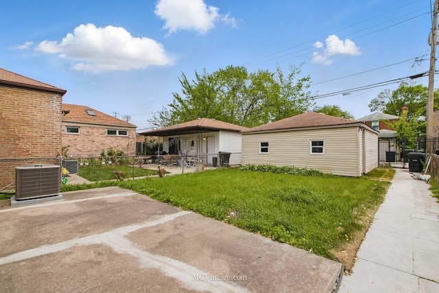 8907 S Luella Ave, Chicago, IL 60617 - rear view of property featuring central AC unit