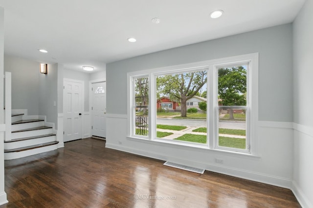8907 S Luella Ave, Chicago, IL 60617 - unfurnished living room featuring stairway, dark wood-style flooring, recessed lighting, and baseboards