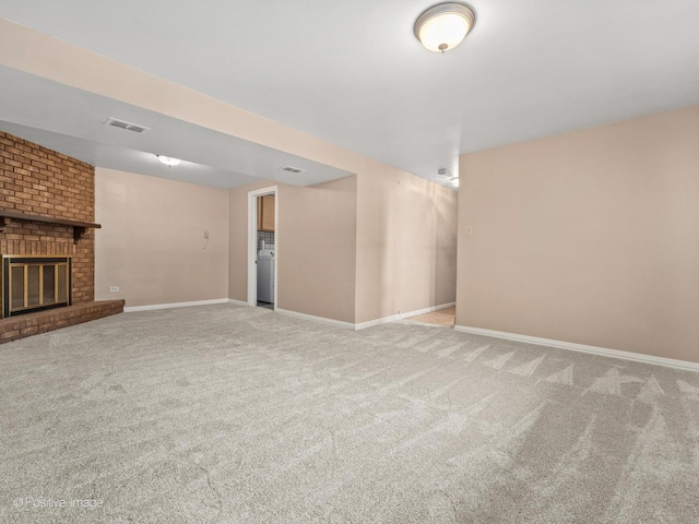8920 Sycamore Dr, Hickory Hills, IL 60457 - finished below grade area featuring carpet flooring, a brick fireplace, baseboards, washer / dryer, and visible vents