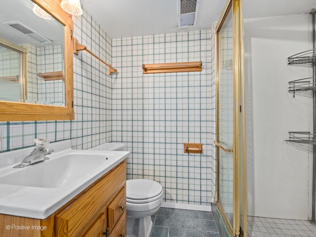8920 Sycamore Dr, Hickory Hills, IL 60457 - bathroom with visible vents, vanity, toilet, and a shower stall