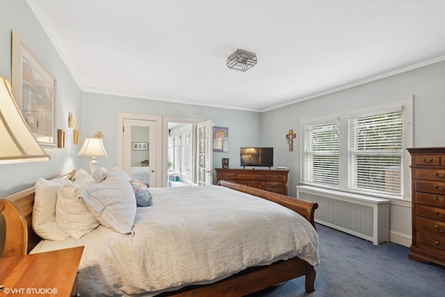 bedroom with radiator heating unit, carpet floors, and crown molding