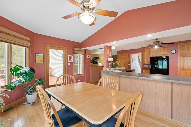 1065 Cedar Creek Dr, Lake Zurich, IL 60047 - dining space with ceiling fan, vaulted ceiling, light wood-style floors, and baseboards