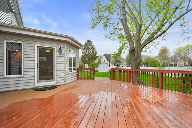 1065 Cedar Creek Dr, Lake Zurich, IL 60047 - deck featuring a storage unit, an outdoor structure, and a yard