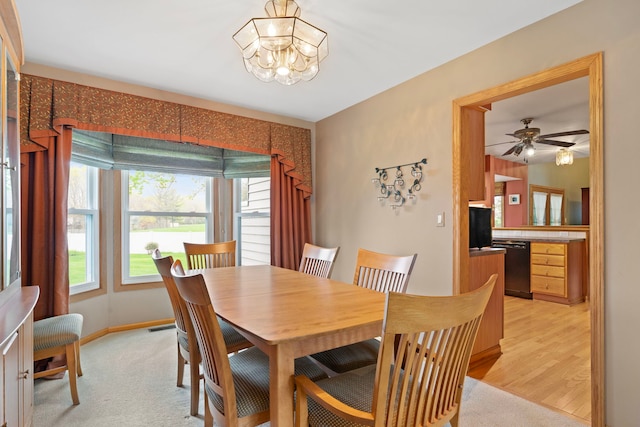 1065 Cedar Creek Dr, Lake Zurich, IL 60047 - dining area featuring a chandelier, a ceiling fan, and baseboards