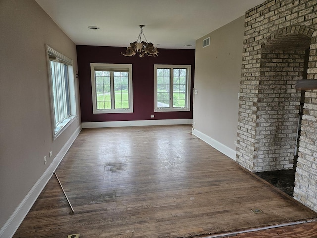 6554 N 16000e Rd, Grant Park, IL 60940 - unfurnished dining area featuring a chandelier, baseboards, and wood finished floors