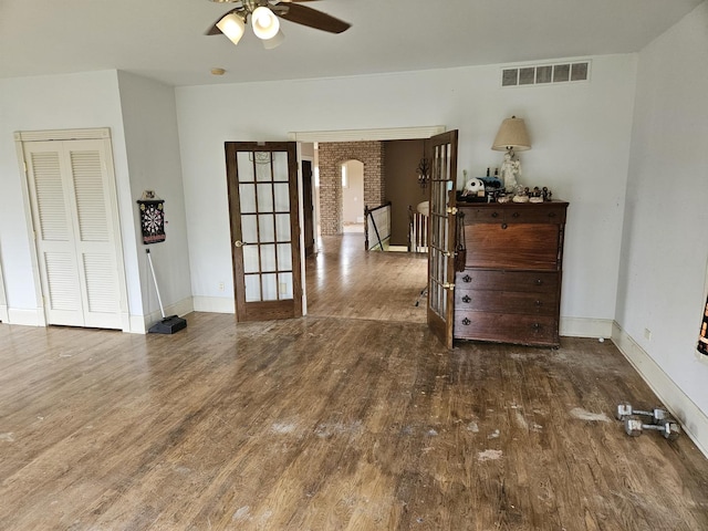 6554 N 16000e Rd, Grant Park, IL 60940 - unfurnished room with wood finished floors, a ceiling fan, french doors, and baseboards