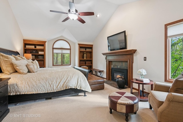 42W142 Ravine Dr, Saint Charles, IL 60175 - bedroom with vaulted ceiling, a glass covered fireplace, ceiling fan, and carpet flooring