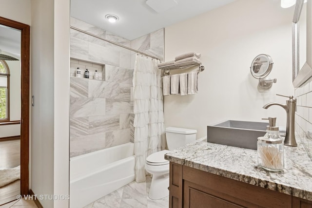 42W142 Ravine Dr, Saint Charles, IL 60175 - bathroom with toilet, vanity, shower / bath combo, marble look tile flooring, and baseboards