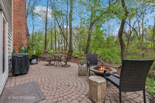 42W142 Ravine Dr, Saint Charles, IL 60175 - view of patio featuring an outdoor fire pit and outdoor dining space