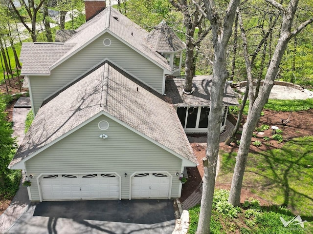 42W142 Ravine Dr, Saint Charles, IL 60175 - view of front of house with asphalt driveway, a shingled roof, and an attached garage