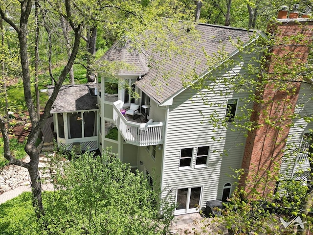 42W142 Ravine Dr, Saint Charles, IL 60175 - back of property with a sunroom and roof with shingles