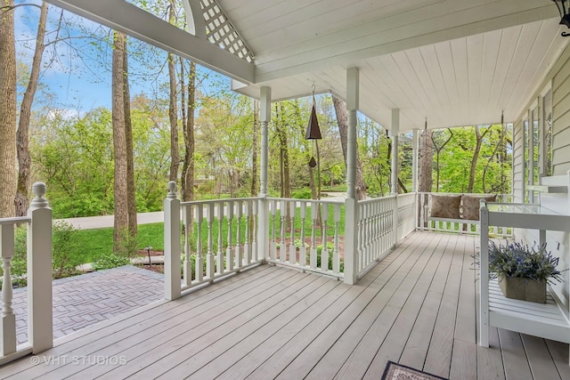 42W142 Ravine Dr, Saint Charles, IL 60175 - wooden deck featuring covered porch and view of scattered trees