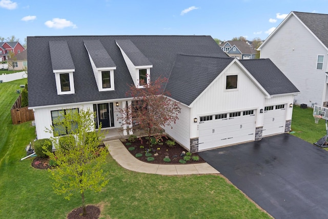 840 Coventry Cir N, Sycamore, IL 60178 - view of front of house featuring a shingled roof, board and batten siding, driveway, and a front lawn