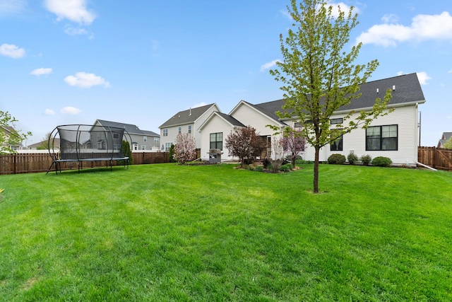 840 Coventry Cir N, Sycamore, IL 60178 - view of yard with a fenced backyard, a trampoline, and a residential view