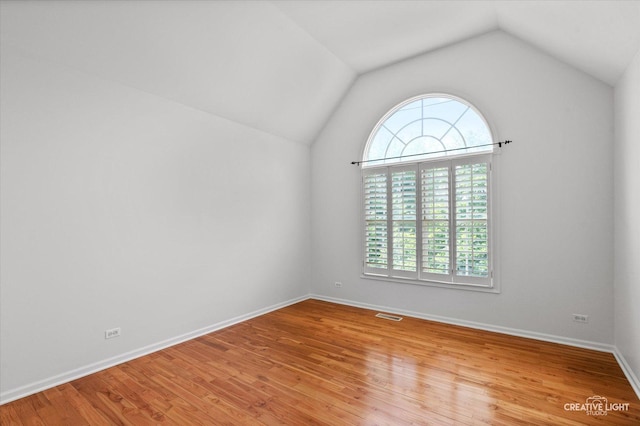 4012 Heron Ct, Naperville, IL 60564 - unfurnished room with lofted ceiling and light wood-type flooring