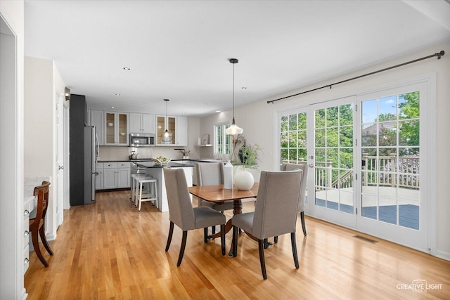 dining area with light wood-type flooring