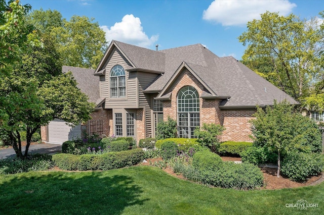 4012 Heron Ct, Naperville, IL 60564 - view of front of home with brick siding, a front yard, a garage, and roof with shingles