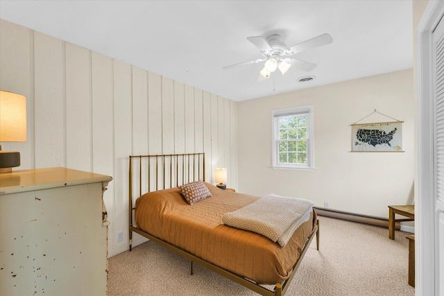 bedroom with baseboards, a ceiling fan, light colored carpet, and visible vents