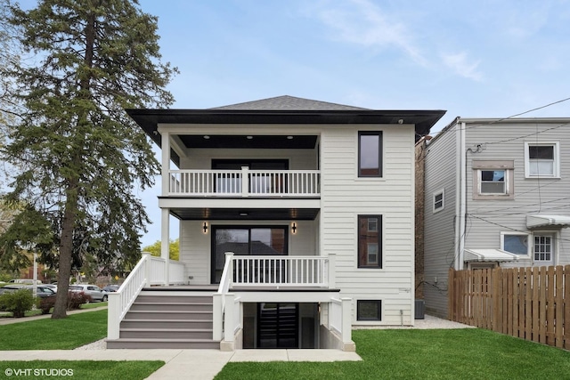 back of house with a yard, stairway, fence, and a balcony