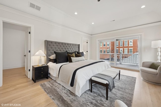 bedroom with light wood-style floors, ornamental molding, access to exterior, and visible vents