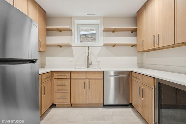 kitchen with beverage cooler, open shelves, visible vents, and stainless steel appliances