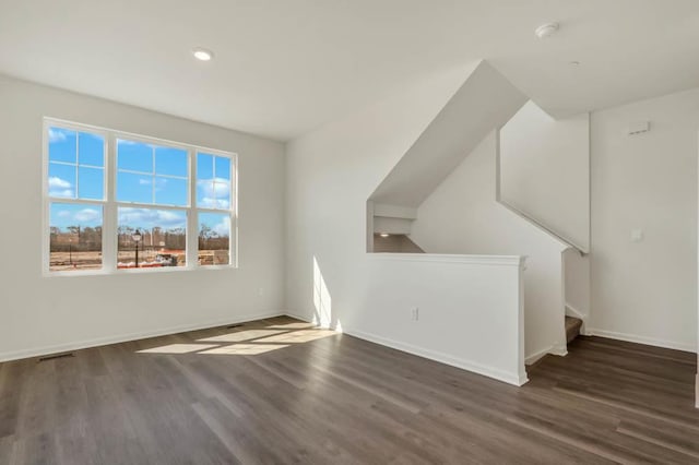 bonus room with recessed lighting, baseboards, and wood finished floors