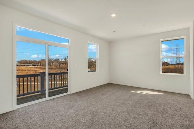 empty room with recessed lighting, carpet flooring, and baseboards