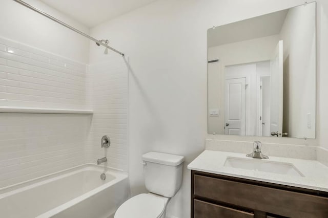 bathroom featuring bathing tub / shower combination, vanity, and toilet